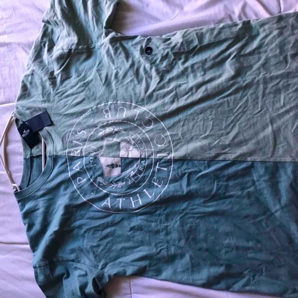 Brand new with tags. Hollister super cute half and half green shirt